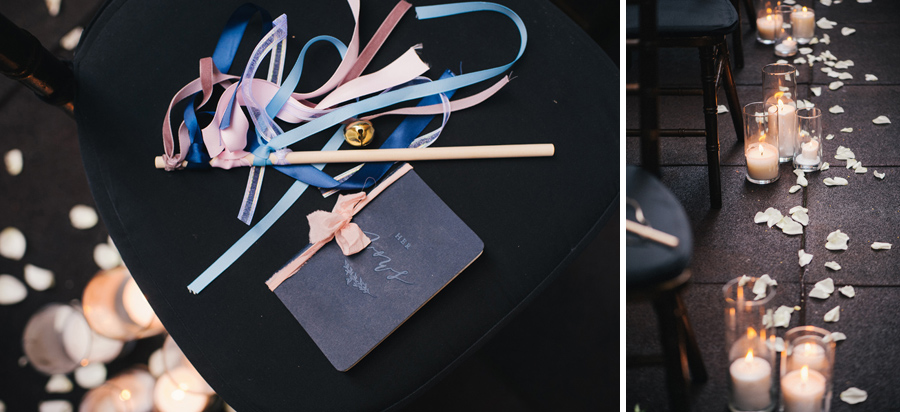 detail shot of the groom's navy blue vow book, a ribbon wand and candles lining the aisle with flower petals