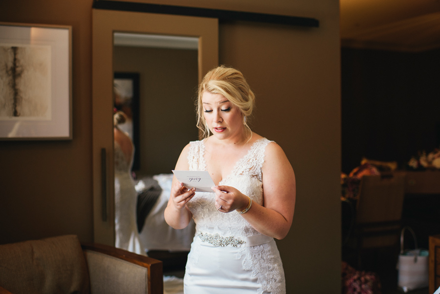 bride reading a card from the groom